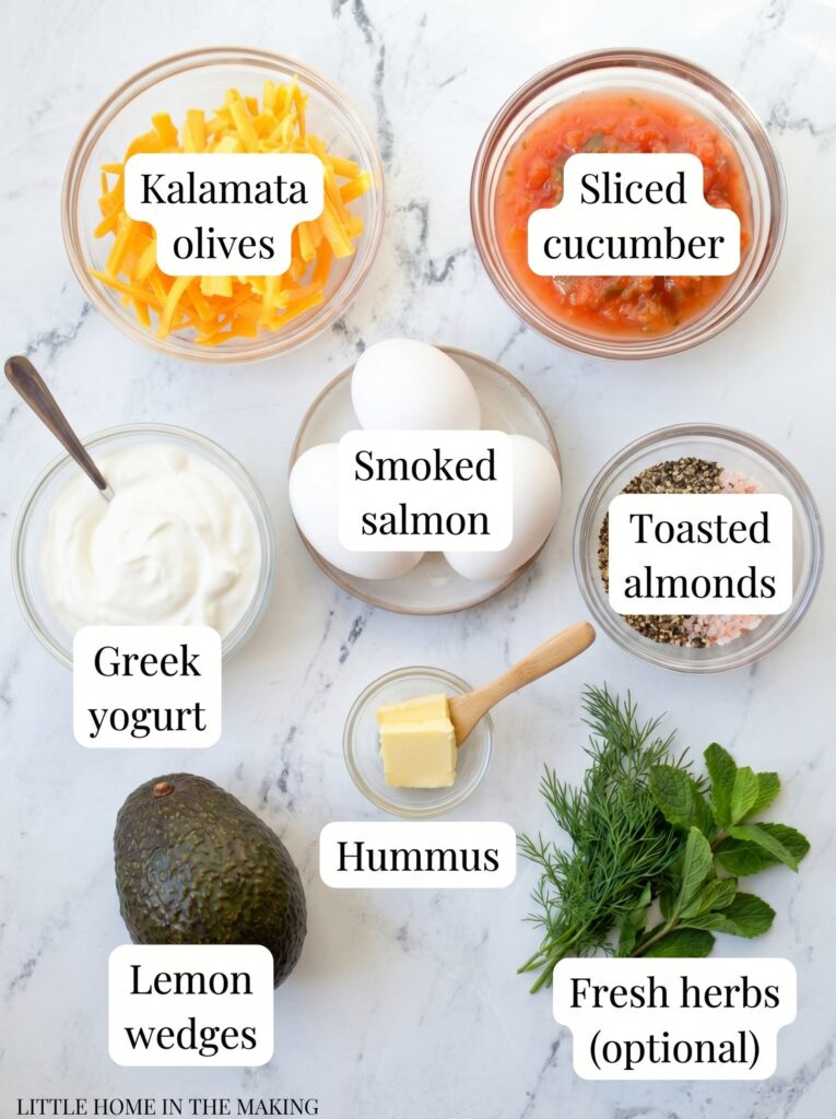 Breakfast ingredients flat lay with eggs, cheese, avocado, herbs, and fresh toppings