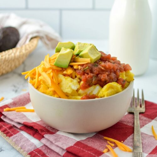 Breakfast Burrito Bowl with eggs, cheddar cheese, salsa, and avocado